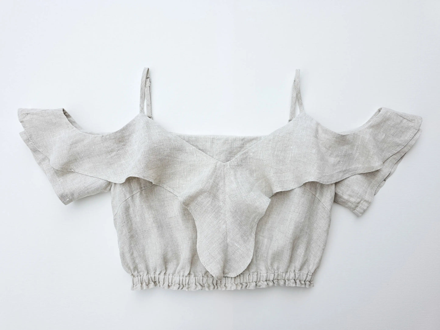 Front view of 100% pure natural flax linen ruffle crop top in a refined natural texture.