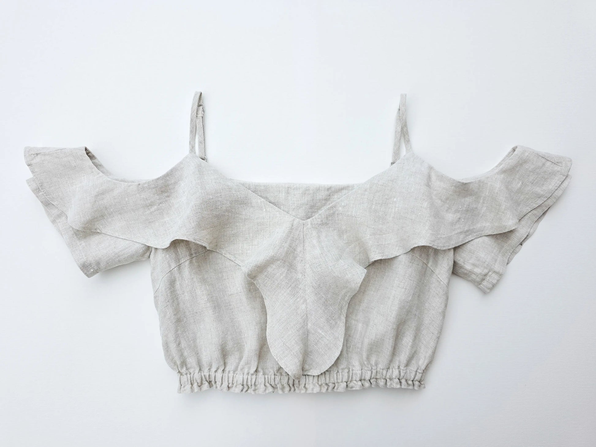 Front view of 100% pure natural flax linen ruffle crop top in a refined natural texture.